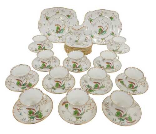 A Tuscan China porcelain part tea service, each decorated with an Asiatic Pheasant in a...