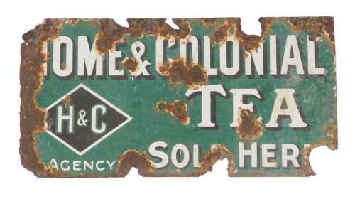 A Home & Colonial Tea enamel double-sided sign, green ground with white lettering, 51cm x 27cm....
