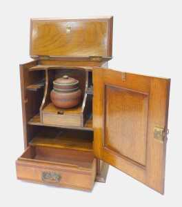 A late 19thC Art Nouveau oak smoker's cabinet, the top with a moulded edge, above a panelled... - 2
