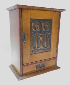 A late 19thC Art Nouveau oak smoker's cabinet, the top with a moulded edge, above a panelled... - 3