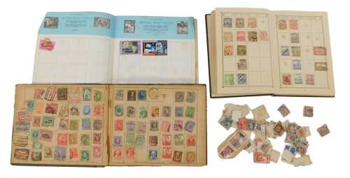 A Lincoln stamp album, containing early 20thC and later world and GB used stamps, loose stamps,...