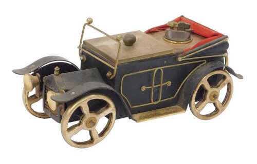 A novelty cigarette box and table lighter modelled as an early 20thC motorcar, 34cm wide.