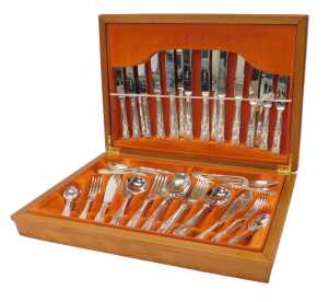 A silver-plated Kings pattern canteen of cutlery, for eight place settings, contained in an oak...