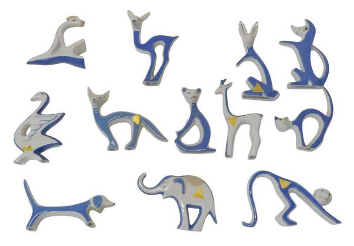 A group of Royal Dux stylised animal figures, in white and blue glaze, to include a cat, 10cm...