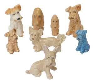 A group of Sylvac pottery dogs, to include a seated Terrier, 19cm high, a blue glaze example,...