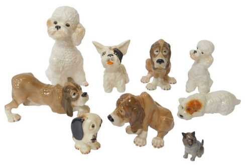 A group of pottery dog figures, to include a Szeiler hound, 15cm high, a Royal Doulton Scottish...