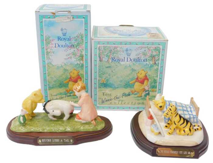 A Royal Doulton The Winner the Pooh Collection Eeyore Loses a Tail figure group, WP15, together...
