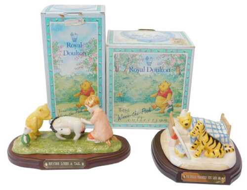 A Royal Doulton The Winner the Pooh Collection Eeyore Loses a Tail figure group, WP15, together...
