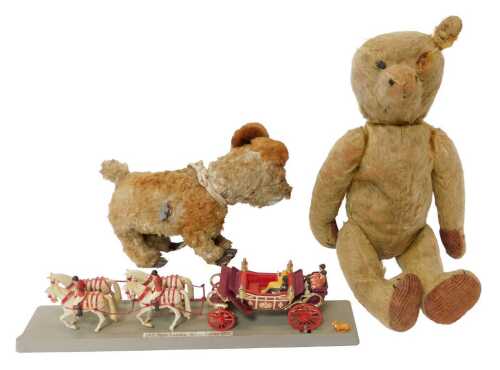 An early 20thC blonde straw-filled Teddy bear, with cord pads, 40cm high, together with a...