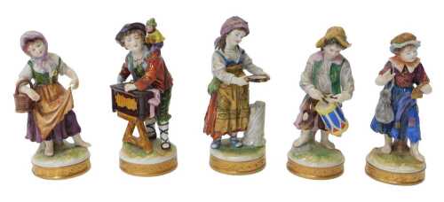 Five Rudolstadt-Volkstedt porcelain figures, each modelled in a differing pose, to include a...