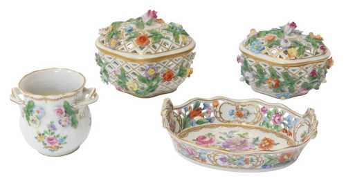 A group of 20thC Dresden porcelain, comprising a pair of pierced, floral-encrusted trinket boxes...