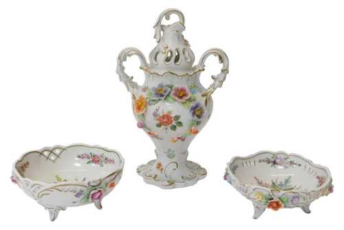 A PMP Plaue porcelain twin handled lidded vase, florally encrusted and decorated with...