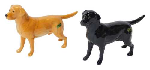 Two Beswick pottery figures modelled as a Black Labrador and a Golden Labrador, 14cm high,...