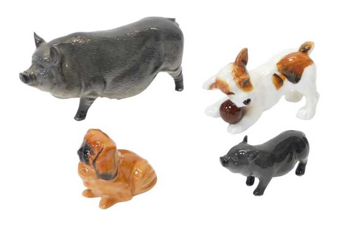 Four Royal Doulton ceramic animal figures, comprising a Vietnamese pot bellied pig, 8cm high,...