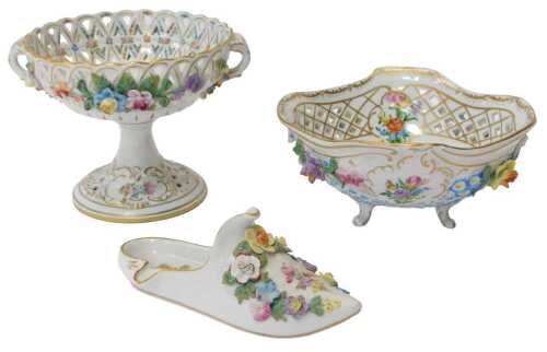 A group of 20thC Dresden porcelain, comprising a florally encrusted pierced dish, 19cm high, a...