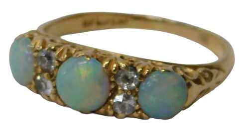A late 19th/early 20thC 18ct gold opal and diamond gypsy ring, set with three raised circular...