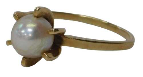 A cultured pearl dress ring, the central cultured pearl in a six-point fan basket design, on a...