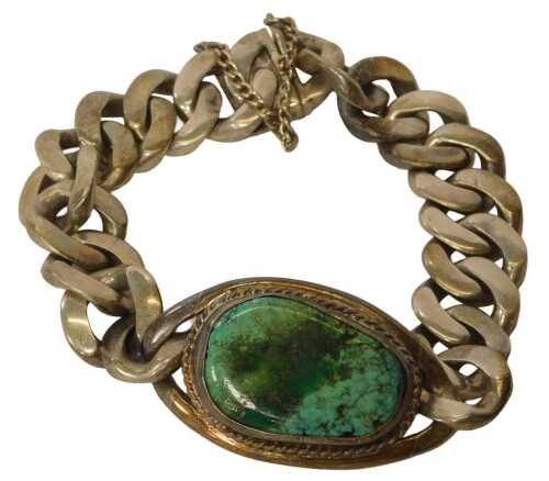 An identity bracelet, the central panel of oval design, set with a turquoise, on a curb link...