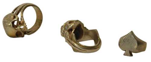 Three Gothic-style dress rings, comprising one with a skull and hands, another with a skull, and...