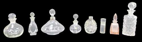 A group of cut glass scent bottles, to include two with silver collars.