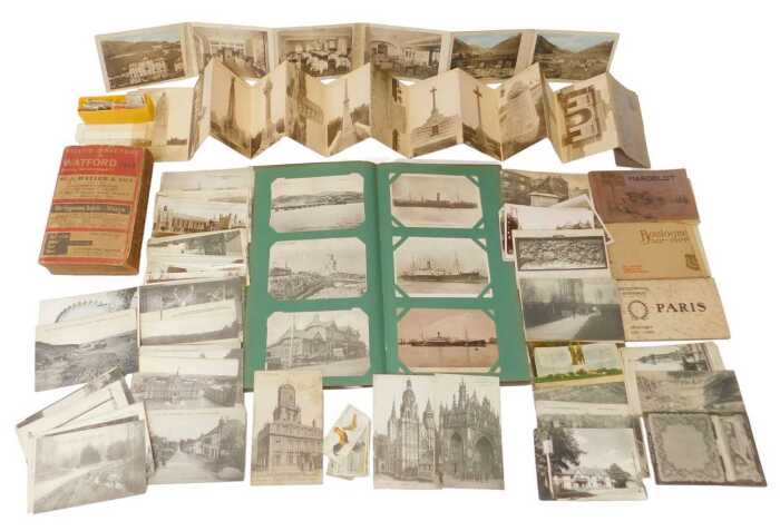 An early 20thC postcard album, and later postcard albums, containing topographical postcards, to...