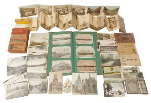 An early 20thC postcard album, and later postcard albums, containing topographical postcards, to...
