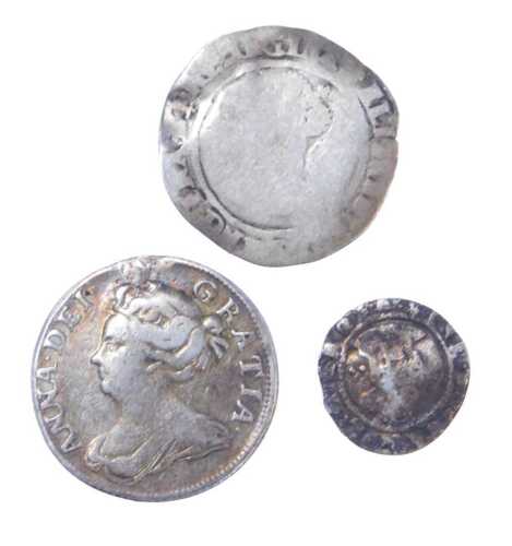 A Queen Anne 1707 silver shilling, together with two further coins, possibly an Elizabeth I half...