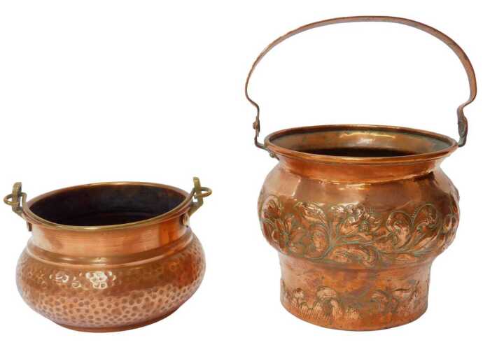 An Art Nouveau copper planter, with a bulbous body and outswept neck, embossed and chased with...