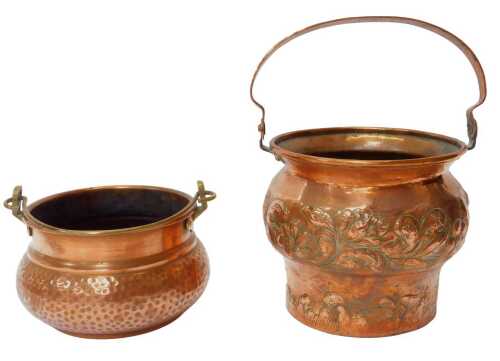 An Art Nouveau copper planter, with a bulbous body and outswept neck, embossed and chased with...