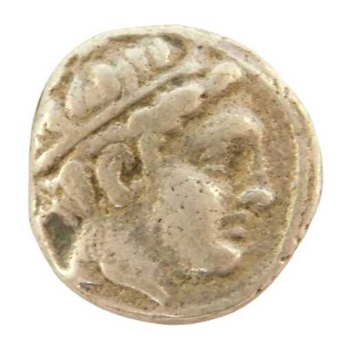 A coin, possibly an Ancient Greek silver 1/5 tetradrachm, obverse head of Apollo, facing right,...