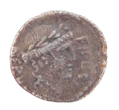 A coin, possibly a Roman Lucinius Nerva silver denarius, obverse laureate head of Fides facing...