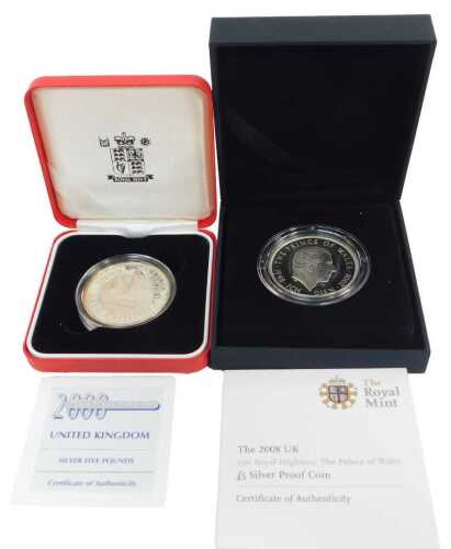 Two Royal Mint silver proof five-pound coins, comprising 2000 Millennium, and 2008 HRH Prince of...