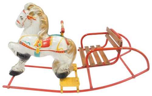 A Sebel Mobo tinplate two piece rocking horse, with a wooden slatted seat and red painted...