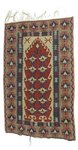 A Turkish Kilim prayer rug, with two rows of medallions within multiple wide borders, 165cm x 100cm.