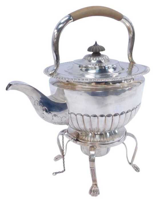 A Victorian Irish silver spirit kettle on stand, the teapot of semi-fluted form, together with a...
