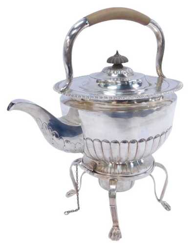 A Victorian Irish silver spirit kettle on stand, the teapot of semi-fluted form, together with a...