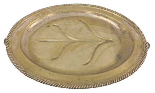 A silver-plated oval twin-handled warming meat tree and well platter, with a gadrooned border,...