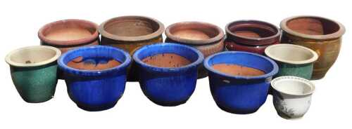 A group of garden plant pots, to include three terracotta blue glazed examples, etc. (a quantity)