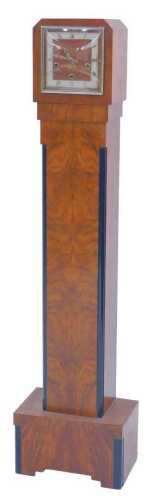 An Art Deco walnut and ebonised grandmother clock, the square dial with silvered Roman numeric...