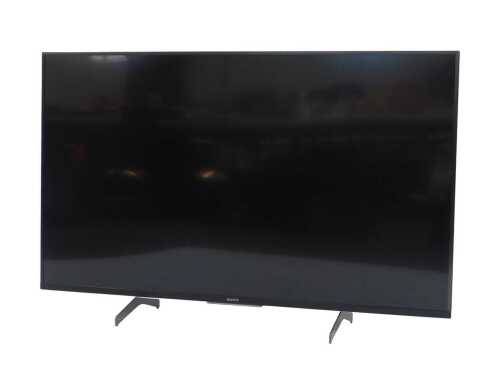 A Sony 49" LCD TV, model number QD-49XH8505.