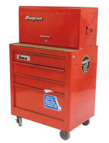 A Snap-On red metal tool chest, containing a quantity of tools, on castors, in two parts, 112cm...