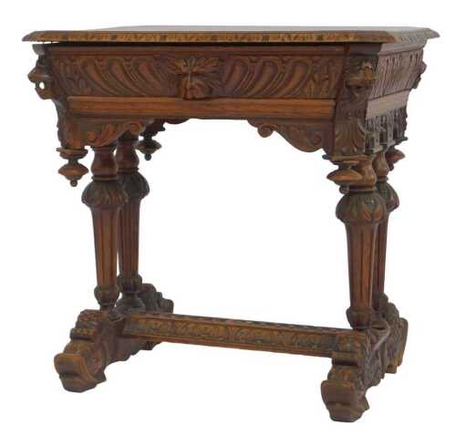 A late 19thC carved oak occasional table, the rectangular top with a carved border and canted...