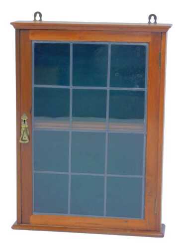 A walnut wall cabinet, with a leaded glazed door, 61cm high, 46cm wide, 10cm deep.