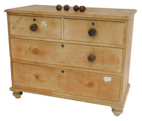 A late 19thC stripped pine chest of drawers, the top with a moulded edge, above two short and...