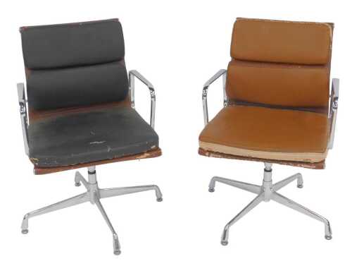 Two similar Eames-style chrome and leather office armchairs, each on an X-shaped base, both in...