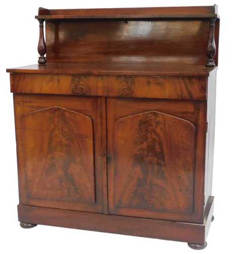 A Victorian figured mahogany chiffonier, the raised back with a gallery, on turned supports, the...