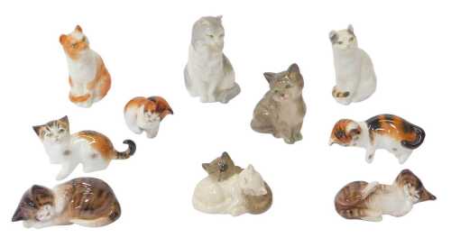 A group of Royal Doulton ceramic cat figures, in varying poses, the largest 7cm high, together...