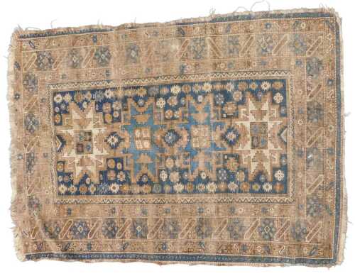 A Turkish blue ground rug, decorated with a single row of medallions within multiple borders,...