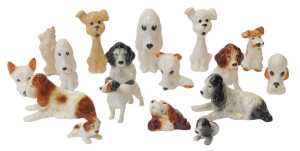 A group of Sylvac pottery dog figures, to include a Spaniel wall plaque, 9cm high, various...
