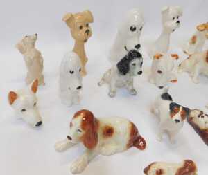 A group of Sylvac pottery dog figures, to include a Spaniel wall plaque, 9cm high, various... - 3
